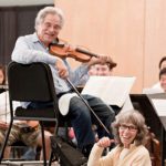 Image of Itzhak and Toby Perlman during a winter recital at USF Sarasota-Manatee campus (photo by Rod Millington)