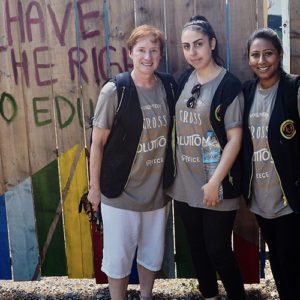 Image of Jody McBrien, PhD, works with volunteers at the Ritsona Refugee Camp in Greece.